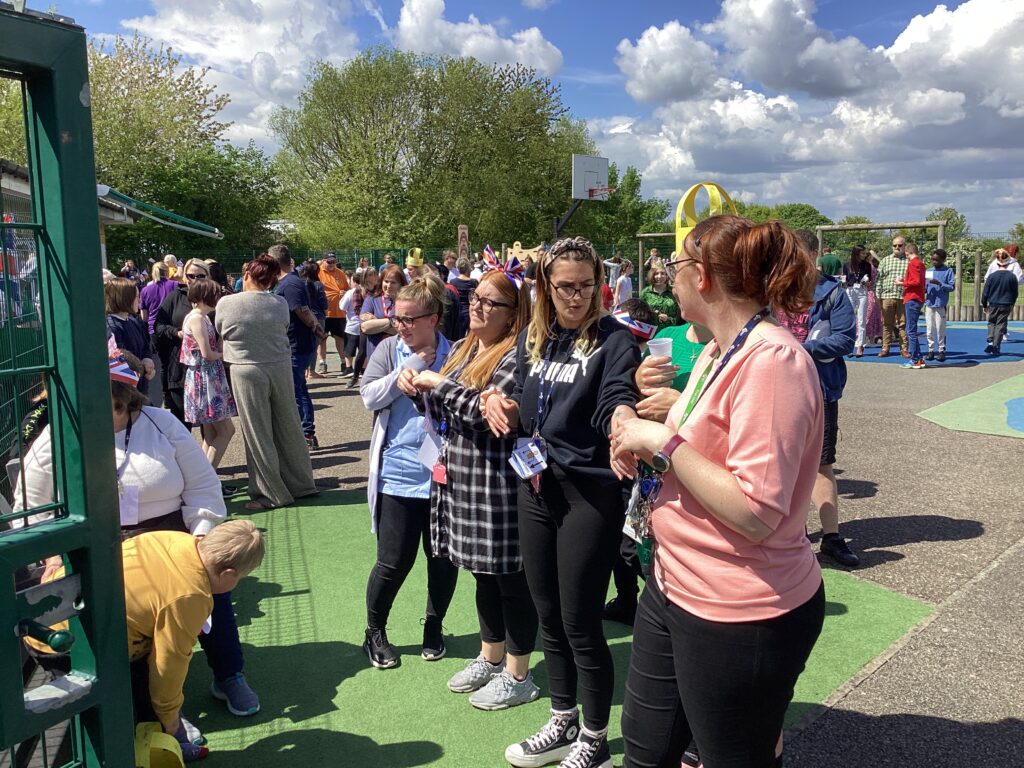 A photo from the Phase 3 Street Party held at Milestone Academy to celebrate the King's Coronation in May 2023.