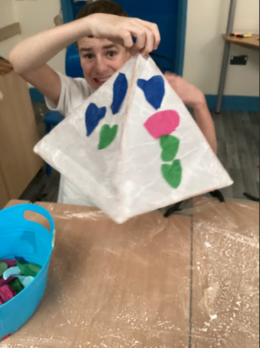 A Milestone@DPA student can be seen holding up a lantern he has created a decorated for the Dartford Festival of Light.