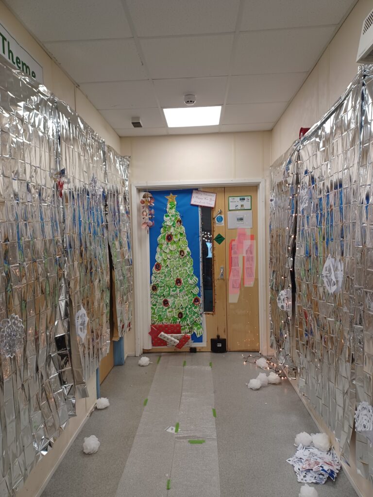 A photo of a classroom door and corridor at Milestone Academy that has been decorated ready for Christmas by students.