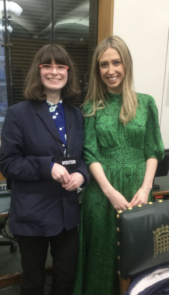 Student stood with Laura Trott in the Houses of Parliament